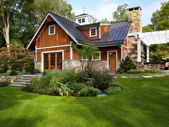 A house with a garden and a lawn