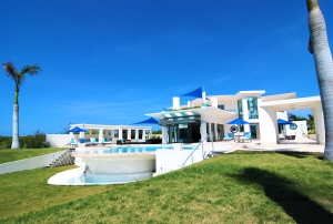 A large pool in the middle of a yard.